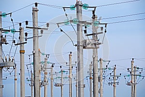 Electrical towers on background of the blue sky