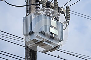 Electrical transformer on a power pole in Thailand, voltage