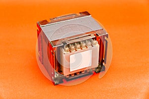 Electrical transformer square type isolated on red background