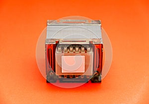 Electrical transformer square type isolated on red background