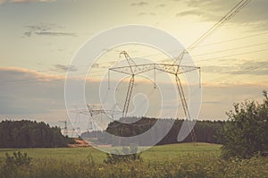 Electrical transmission tower against sunset/Electrical transmission tower against sunset. Toned