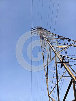 Electrical transmission tower under sky