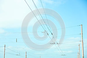 Electrical wires against sky