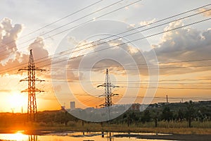 Electrical wires on the background of the sunset sky