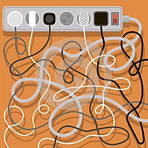 Electrical wires and chargers on orange background. A mess of cables from several extension cords. Cable management