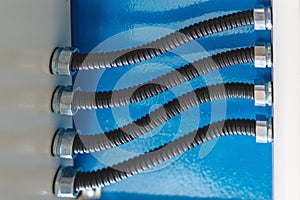 The electrical wires in the corrugated protection are attached to the cable duct by means of nuts.