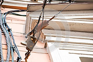 Electrical wires on the facade of an old building