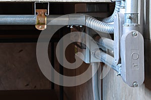 Electrical wiring work in a steel pipe of a house with a loft style design