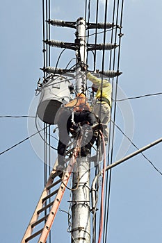 Electrical worker repairing the installation