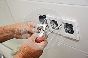 Electrican repair and installing socket, outlet plug