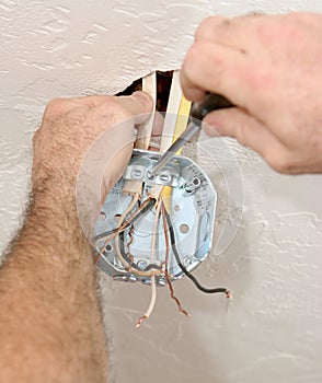 Electrician Attaching Ceiling Box