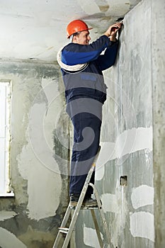 Electrician at cable wiring work