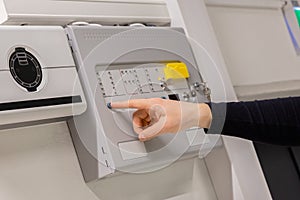 Electrician Checking Fire Alarm Panel In Datacenter