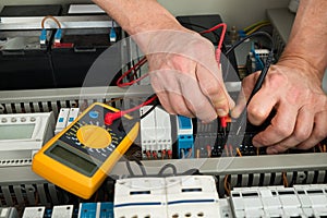 Electrician checking fuse