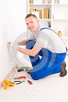 Electrician checking socket