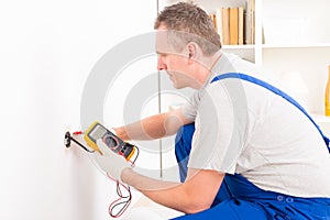 Electrician checking socket