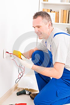 Electrician checking socket