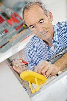 Electrician checking voltage