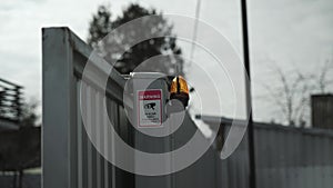 Electrician connects the yellow Signal Lamp for the gate. Warning yellow flash lamp