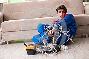 The electrician contractor with tangled cables