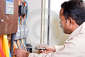 Electrician at electric panel