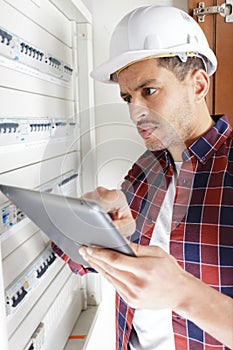 electrician engineer holding tablet computer