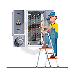 Electrician engineer man working with fuse box