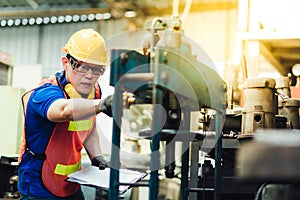 Electrician Engineers repairing machinery in industrial plants. worker Working at the Heavy Industry Manufacturing Facility