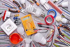 Electrician equipment on metalic background, top view