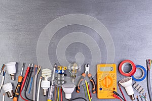 Electrician equipment on metalic background, top view photo