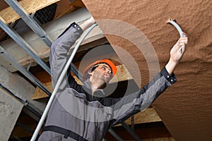 Electrician fitting a cable
