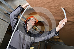 Electrician fitting a cable