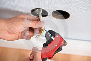 Electrician hands stripping wires