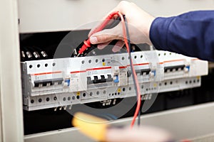 Electrician hands at work closeup