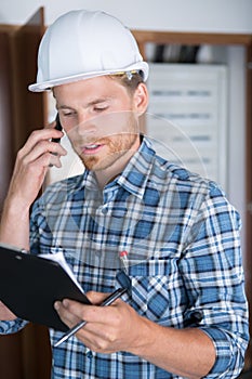 Electrician holding a folder