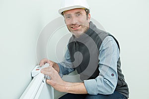 electrician inspecting the radiator