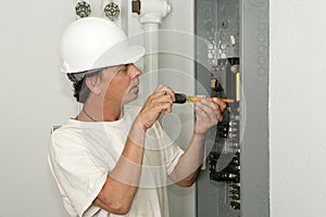Electrician Installing Breaker img