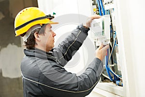 Electrician installing energy saving meter