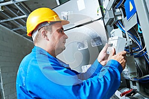 Electrician installing energy saving meter