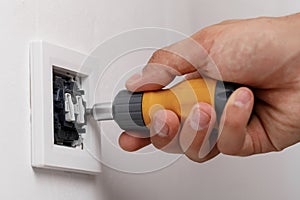 Electrician installing light switch