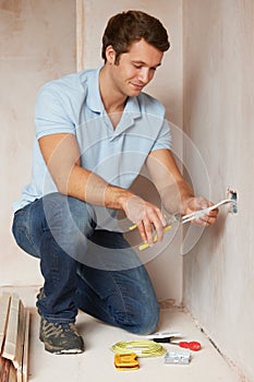 Electrician Installing Socket In New House