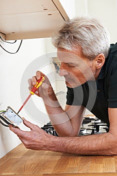 Electrician Installing Socket In New House