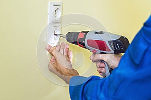 Electrician Installing Socket In New House
