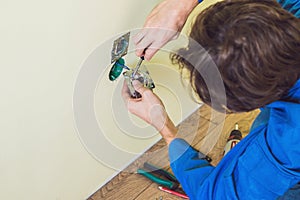 Electrician Installing Socket In New House