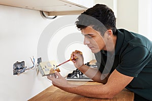 Electrician Installing Socket In New House photo