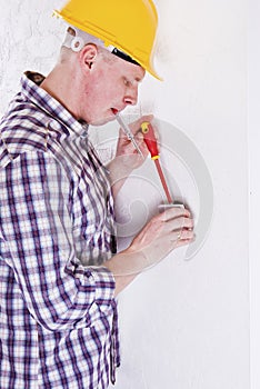 Electrician installing a switch