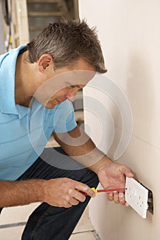 Electrician Installing Wall Socket