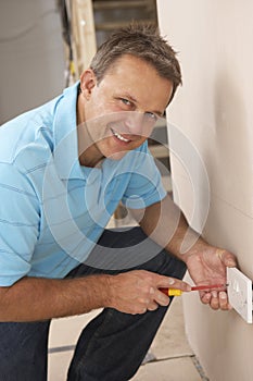 Electrician Installing Wall Socket