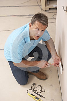 Electrician Installing Wall Socket