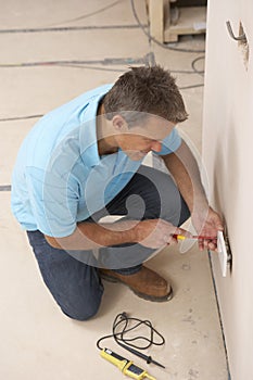 Electrician Installing Wall Socket